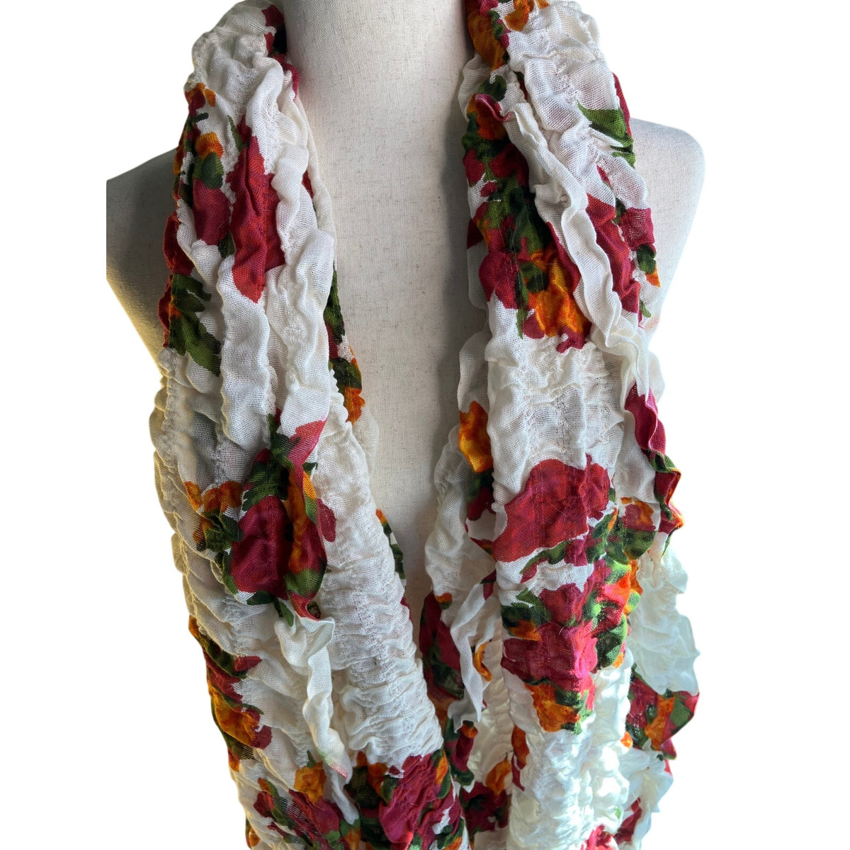 Lightweight semi-sheer scarf in a soft sage/gray-green tone with a delicate multicolor floral